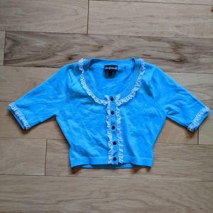 Small blue Sourpuss sweater white lace trim